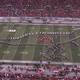 Illustration for article titled The Ohio State University marching band created a chomping T-Rex for its pretty amazing film-themed halftime show